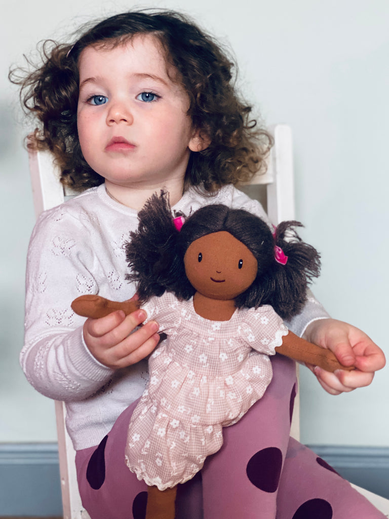 mia rag doll with dark hair embroidered face and floral tiered dress. completely plastic-free