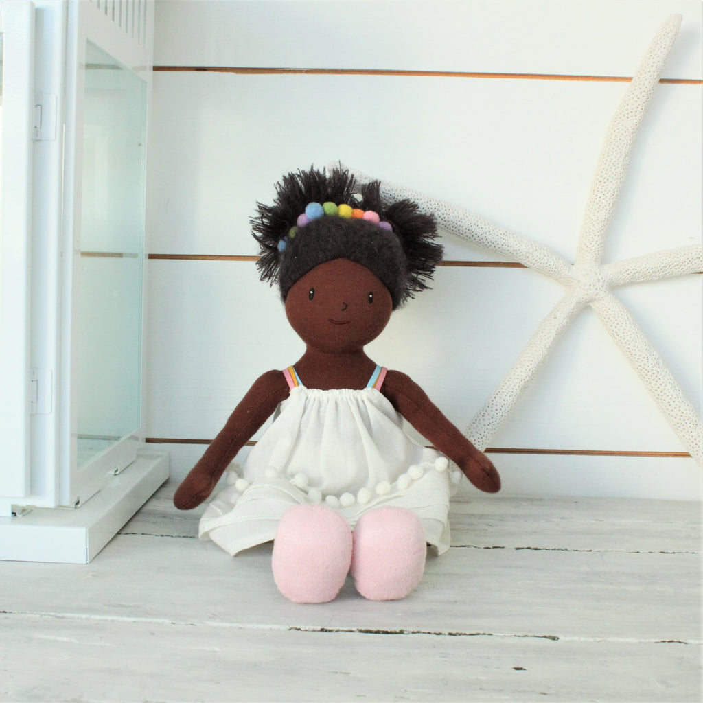 plastic-free rag soft doll with rainbow hair band and white dress