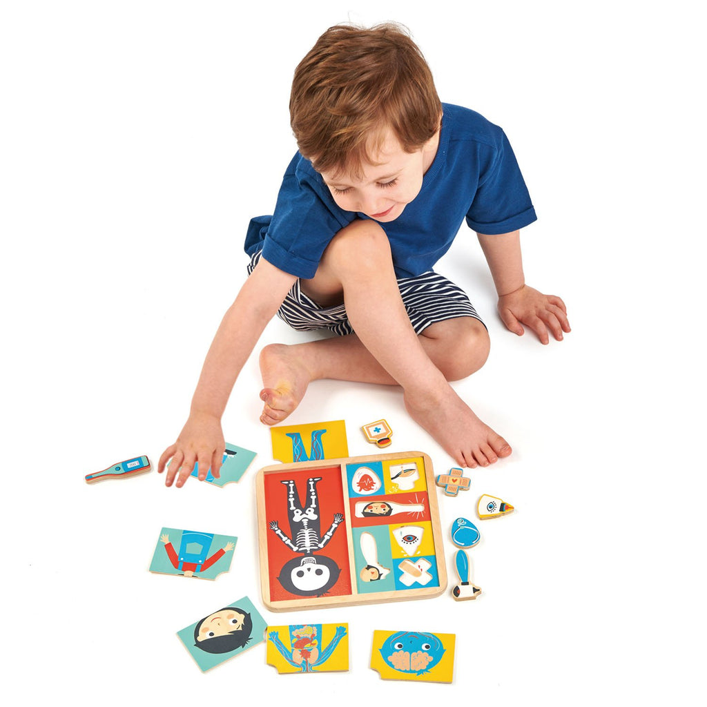 Tender Leaf Wooden toys puzzle with 12 pieces that teaches and explores how the body is made up